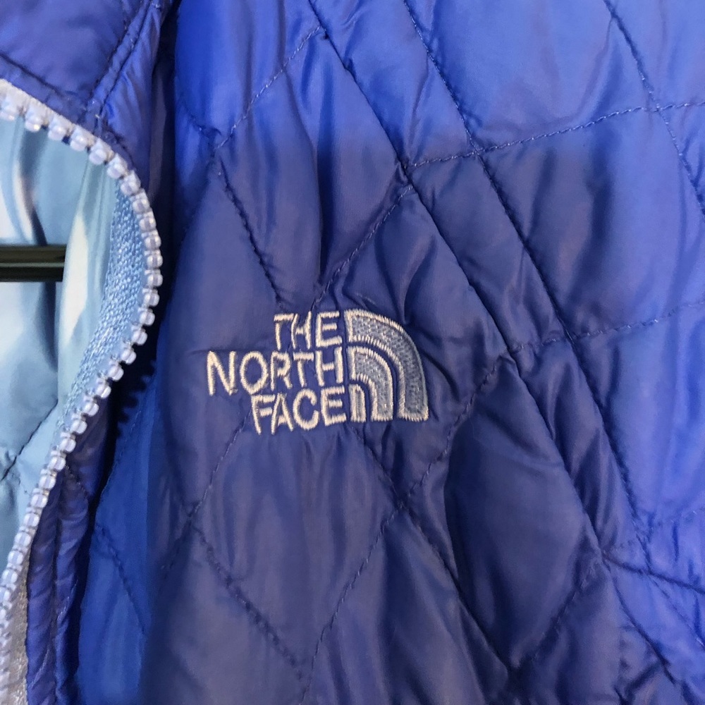 blue north face puffer jacket